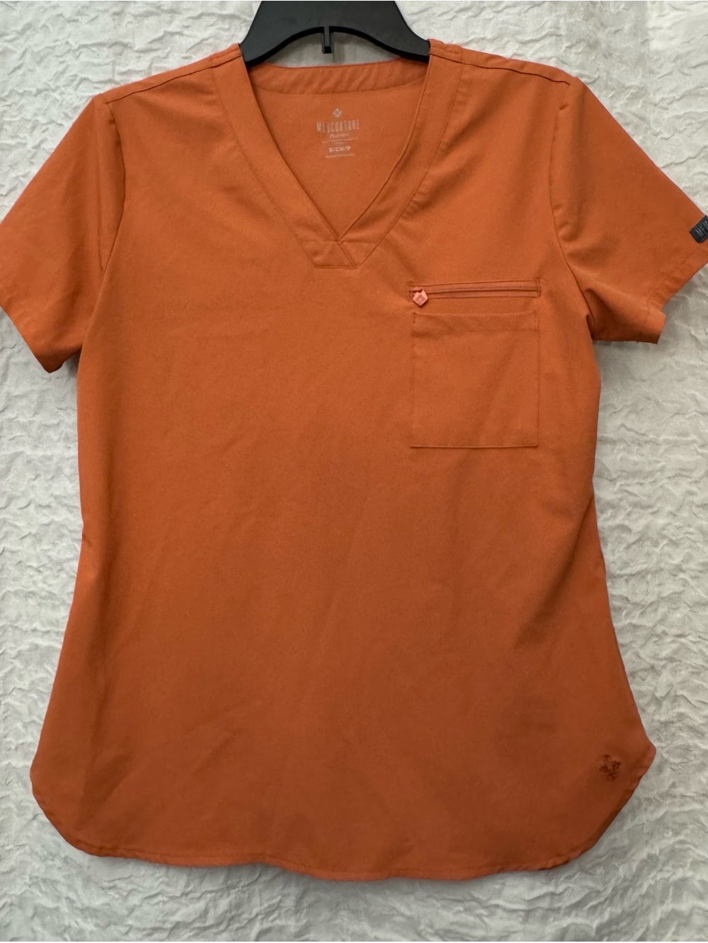 Med Couture V-Neck Chest Pocket Top. Size Small. Color: Cinnamon.